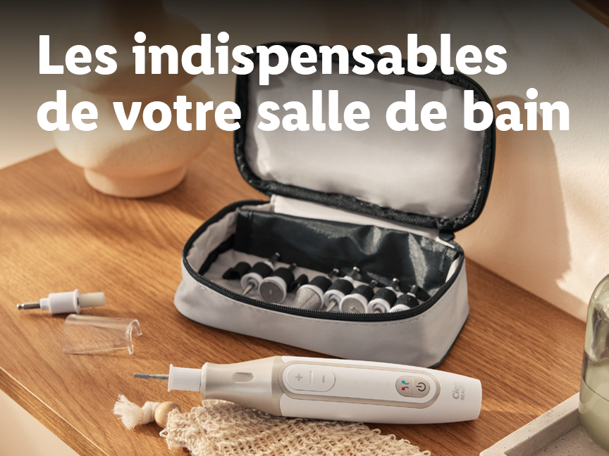 Un kit de manucure/pédicure électrique avec ses accessoires dans une trousse sur une table en bois.