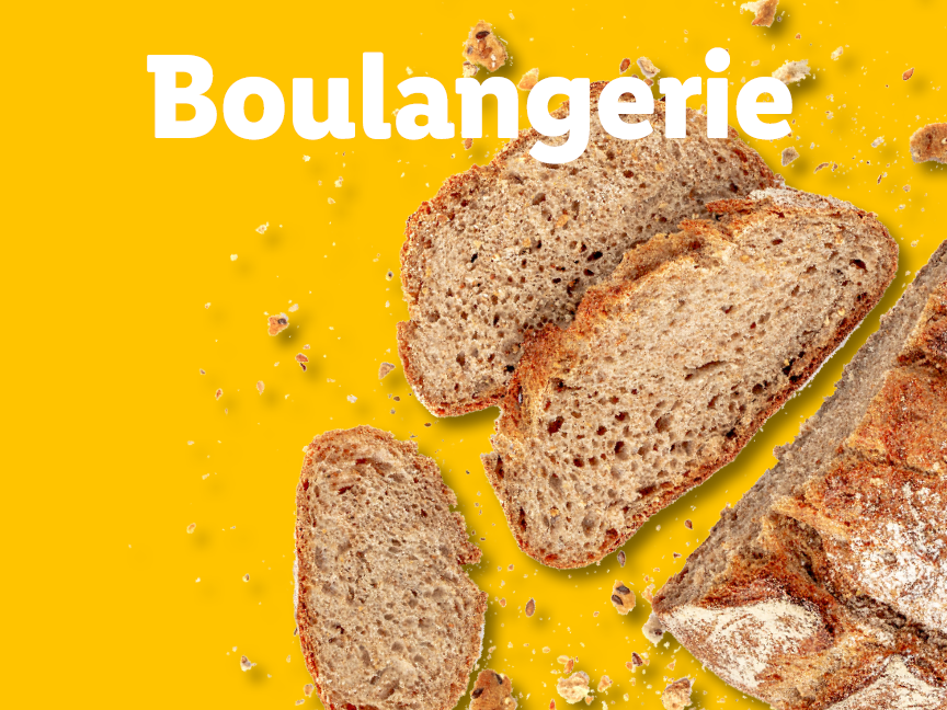Tranches de pain de campagne sur fond jaune avec le mot 'Boulangerie'.